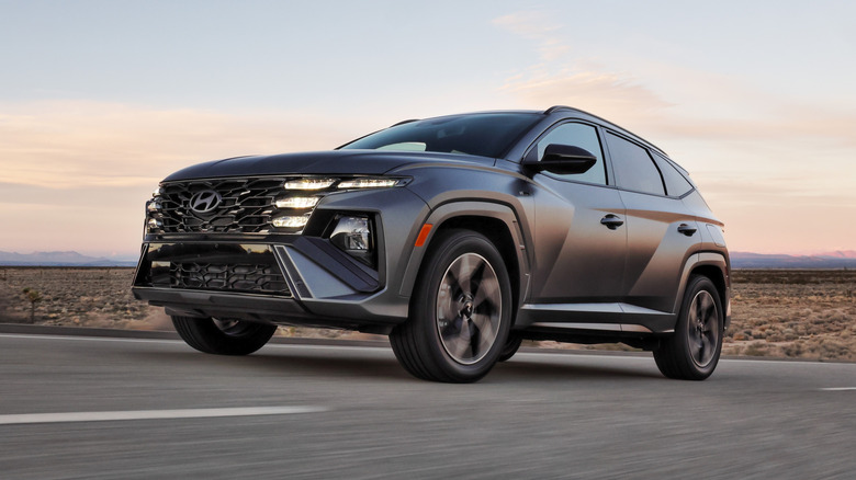 A black 2026 Hyundai Tucson driving