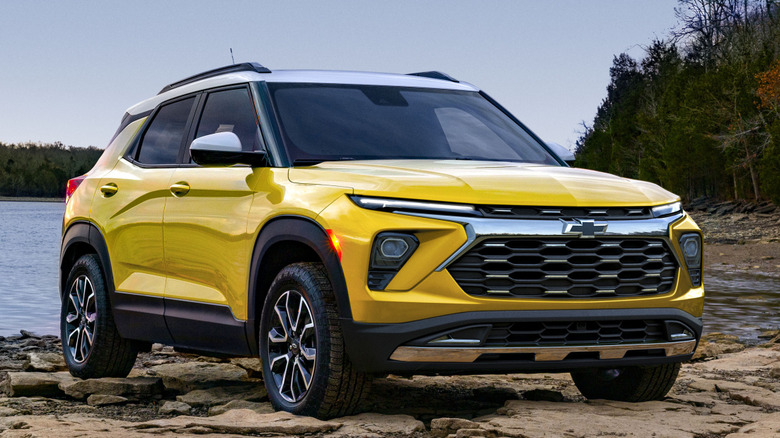 Front 3/4 view of Chevrolet Trailblazer on rock bank by a lake