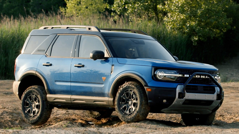 Front 3/4 view of Ford Bronco Sport traversing bumps in the dirt