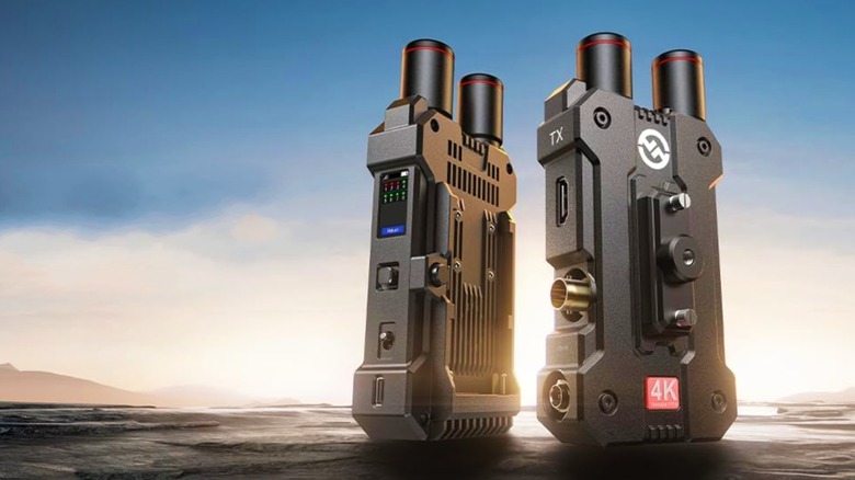 Hollyland Mars 4K Wireless Transmitter Receiver next to itself on a rocky floor.