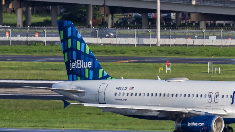 two JetBlue Airbus A320 family planes on the tarmac