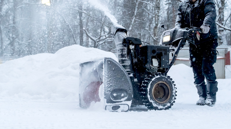 Person using a snow blower