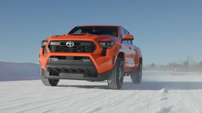 Toyota Tundra driving in snowy conditions, front low-angle view
