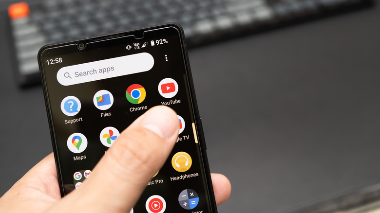 Android phone with YouTube app on screen