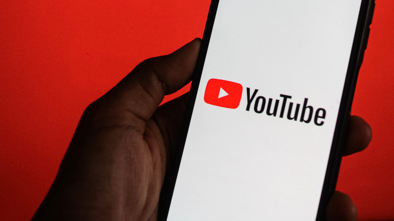 YouTube logo on smartphone screen