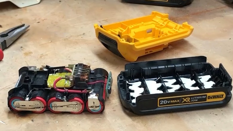 A disassembled 20V DeWalt battery on a table.