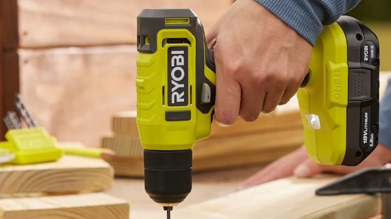 Person using Ryobi drill