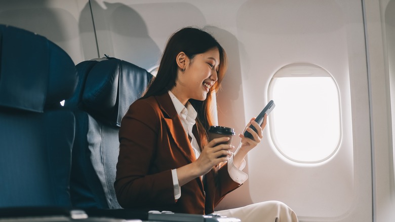 woman sitting at airplane window seat