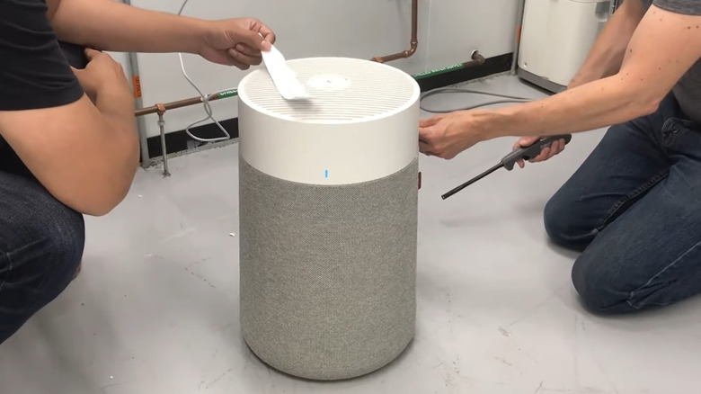 Two guys testing air purifier