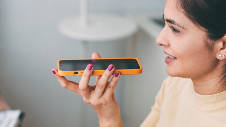 woman speaking into phone