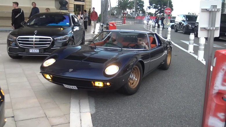 Lando Norris driving his Lamborghini Miura P400