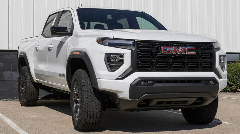 A white GMC Canyon parked