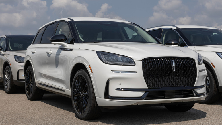 A white Lincoln Corasir parked
