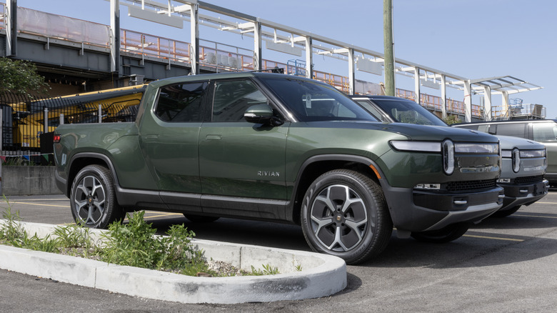 A green Rivian R1T parked
