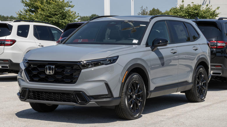 A gray Honda CR-V in front of other vehicles.