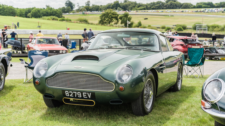 A green Aston Martin DB4 GT