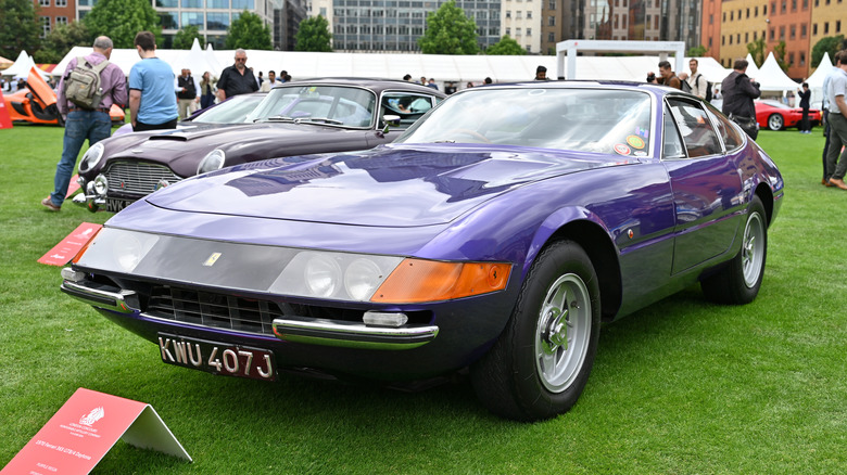 A purple Ferrari 365 GTB/4 on display