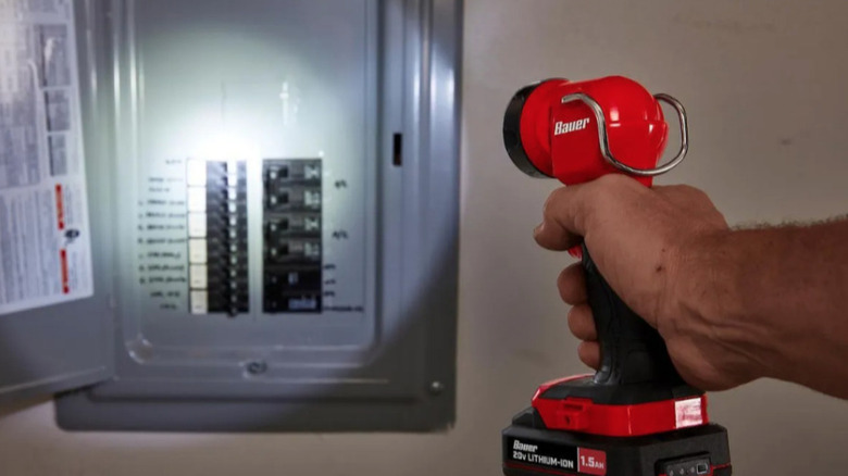 Bauer work light shining on electrical panel
