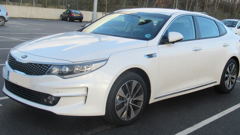 White 2015 Kia Optima parked