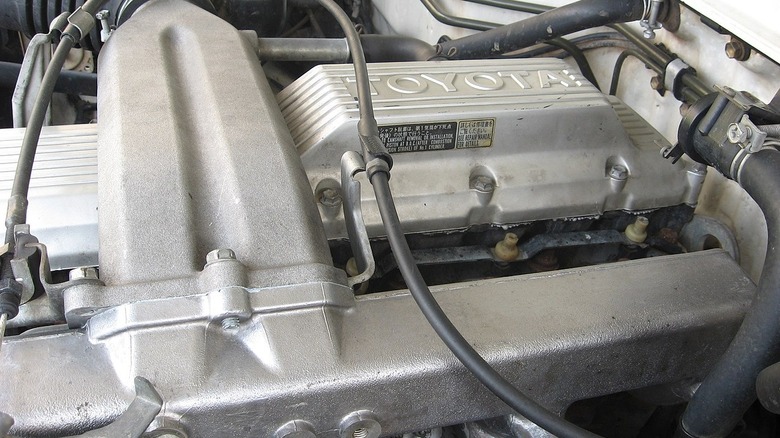 close up view of the 1HZ Toyota engine in an engine bay