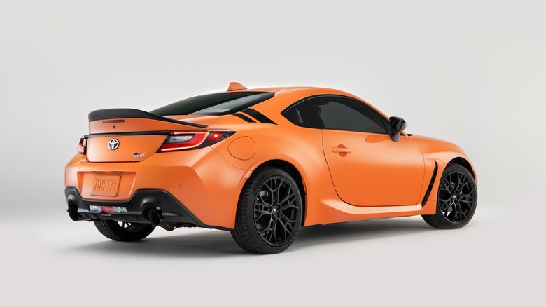 Rear 3/4 of the 2023 Special edition SolarShift Toyota GR86 in studio.
