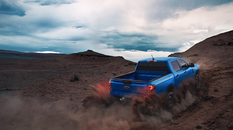 2025 Ford Ranger driving up off-road dirt path