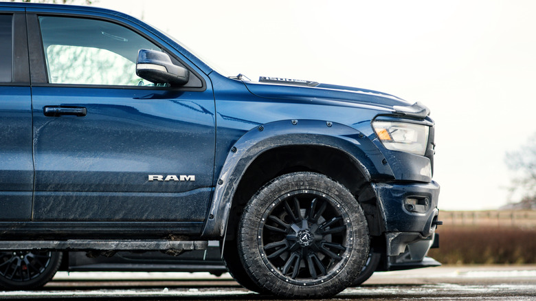 Side view of a blue Ram 1500.