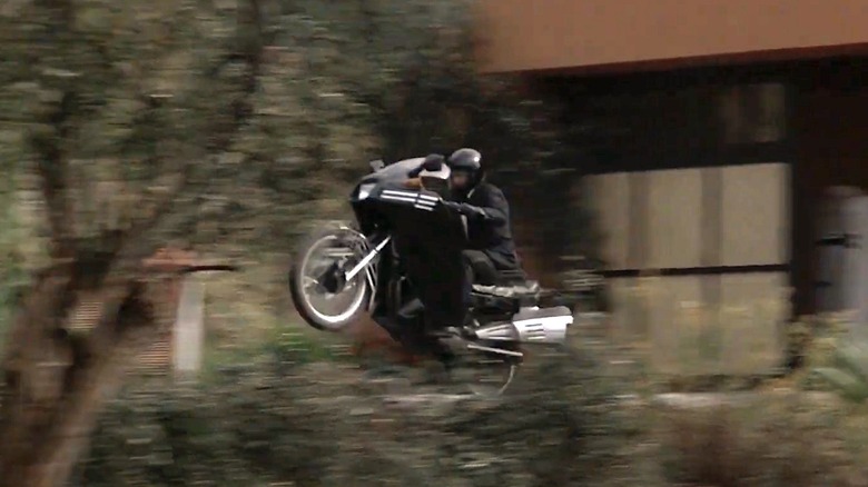 Stunt person riding a Yamaha motorcycle in James Bond movie