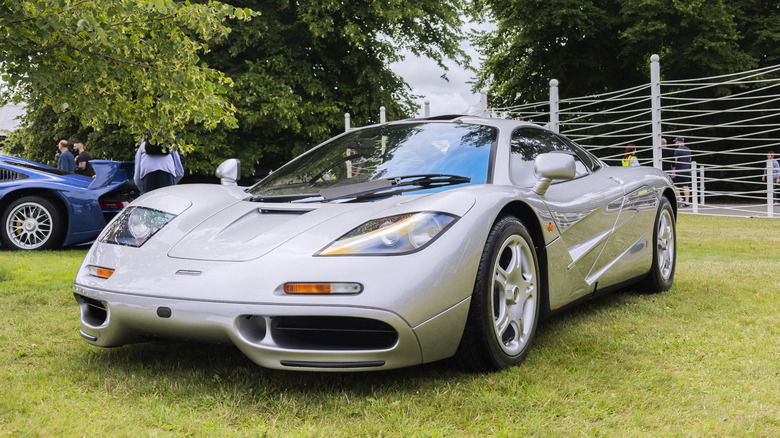 A silver McLaren F1 on display.