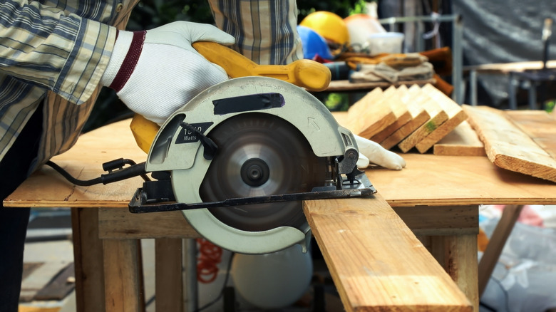 cutting a board with a circular saw