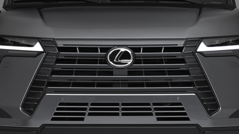 Close shot of Lexus logo on front of Lexus GX
