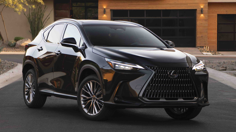 Front 3/4 view of Lexus NX in residential setting