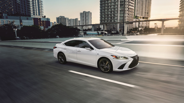 A side shot of a white Lexus ES Hybrid