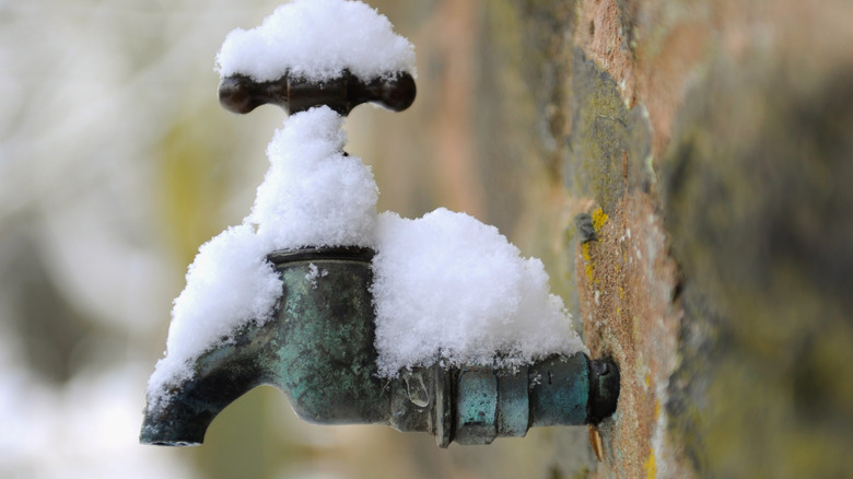 An exterior pipe covered in snow.