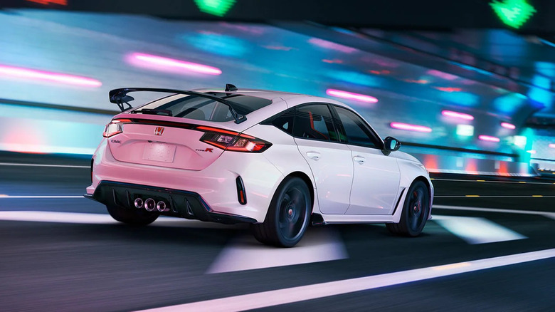 A white 2026 Honda Civic Type R drives down a city circuit