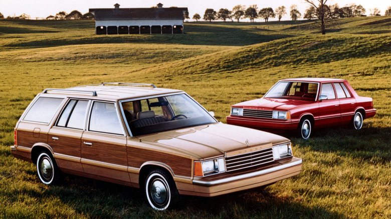 Dodge Aries sedan and Station Wagon in a field