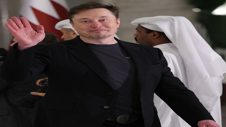 elon musk at state dinner in qatar
