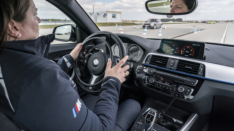 A woman driving on a road.