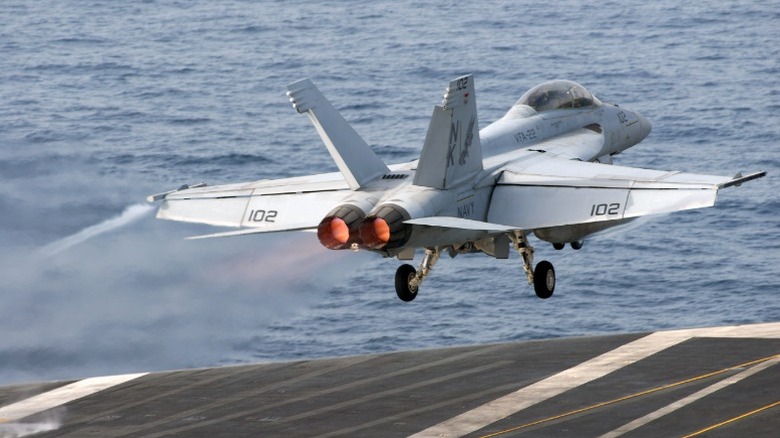 An F/A-18 Super Hornet taking off from an aircraft carrier