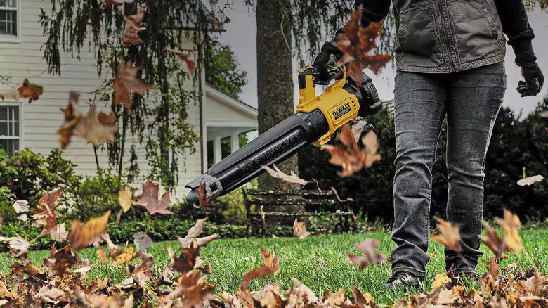 Woman using DeWalt blower