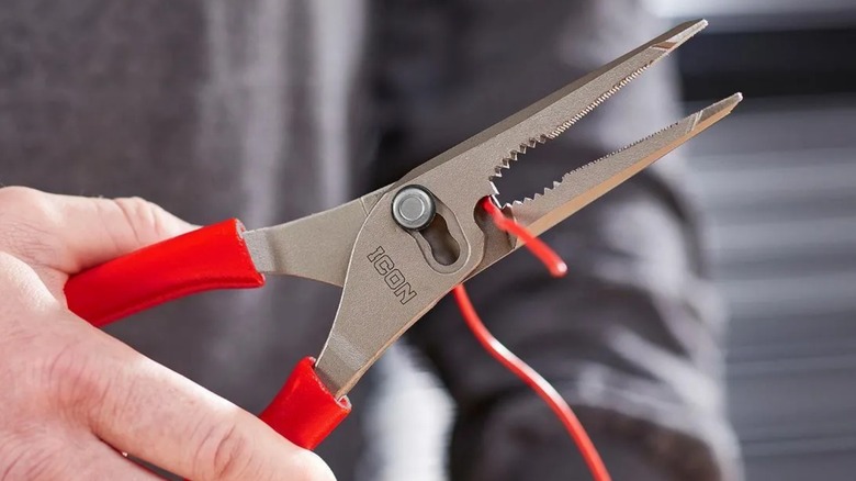 Man using Icon pliers to cut wire