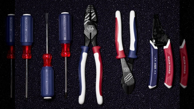 Klein Tools 250th Edition products on a dark background