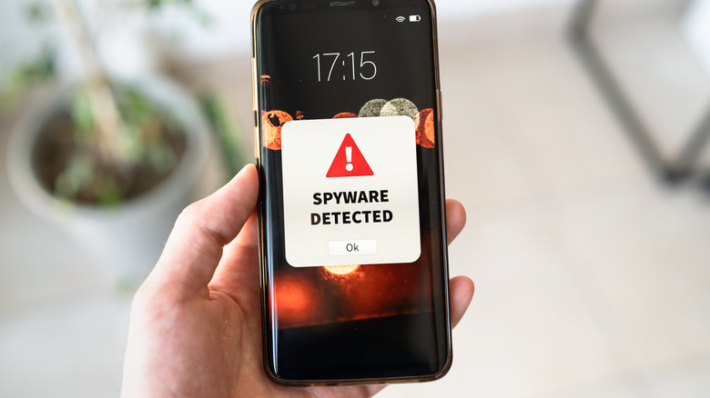 Spyware detected warning on a smartphone.