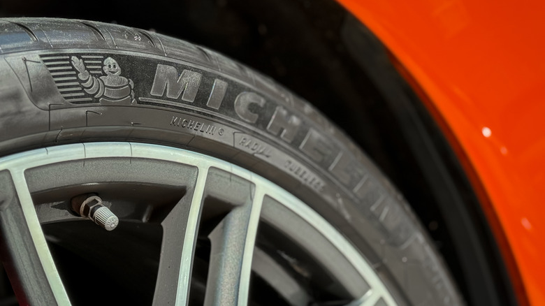 close-up of Michelin logo on tire on a red vehicle