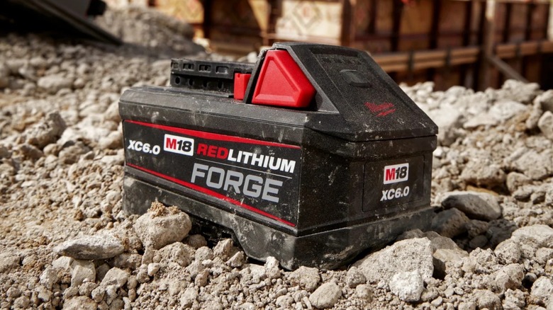 Milwaukee battery sitting on gravel
