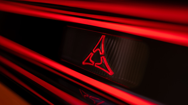 Close up view of red Dodge logo on 2027 Dodge Charger.