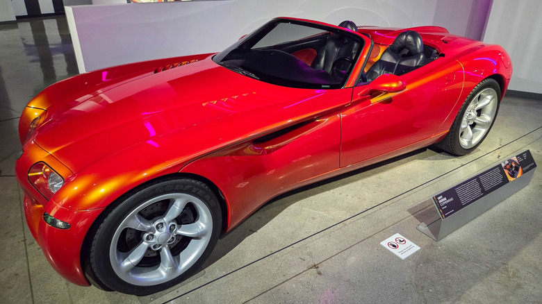 Front 3/4 view of orange 1990s Dodge Copperhead Concept parked in museum.