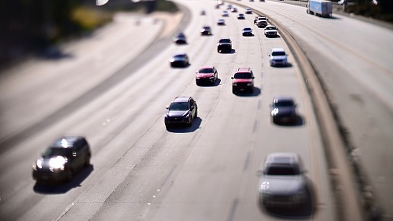 Multiple Vehicles Cruising Down A Highway