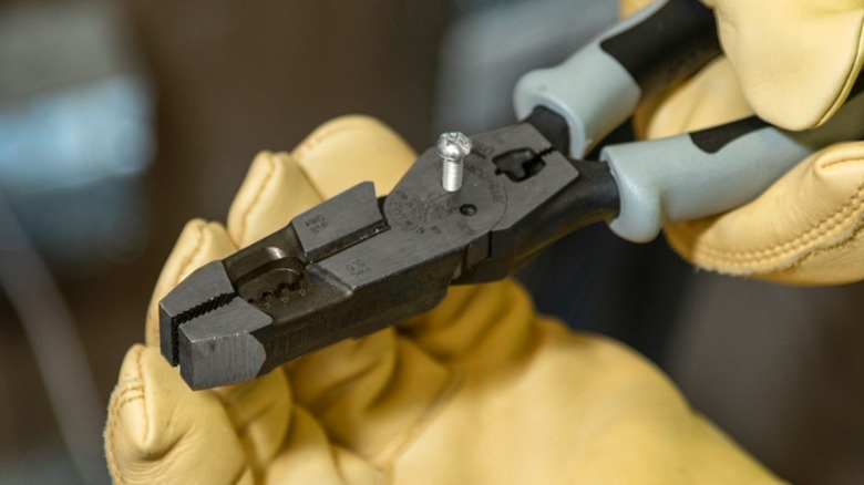A person using Klein Tools' hybrid pliers.