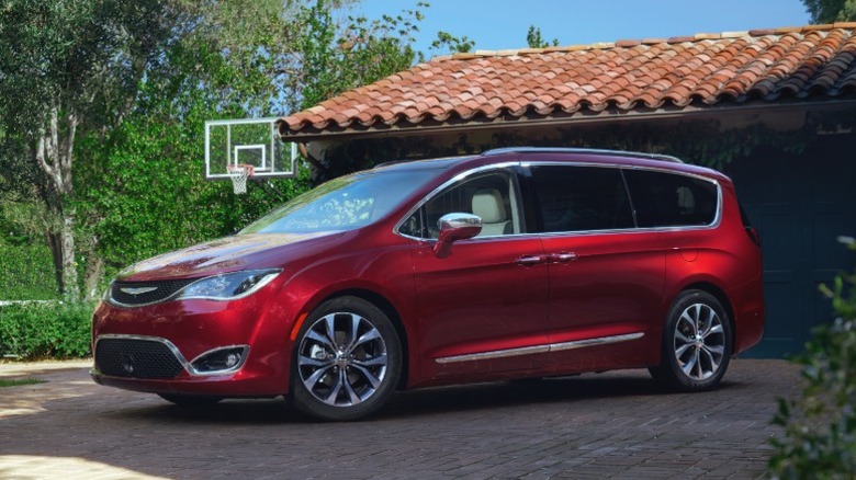 Red 2020 Chrysler Pacifica parked in front of a house